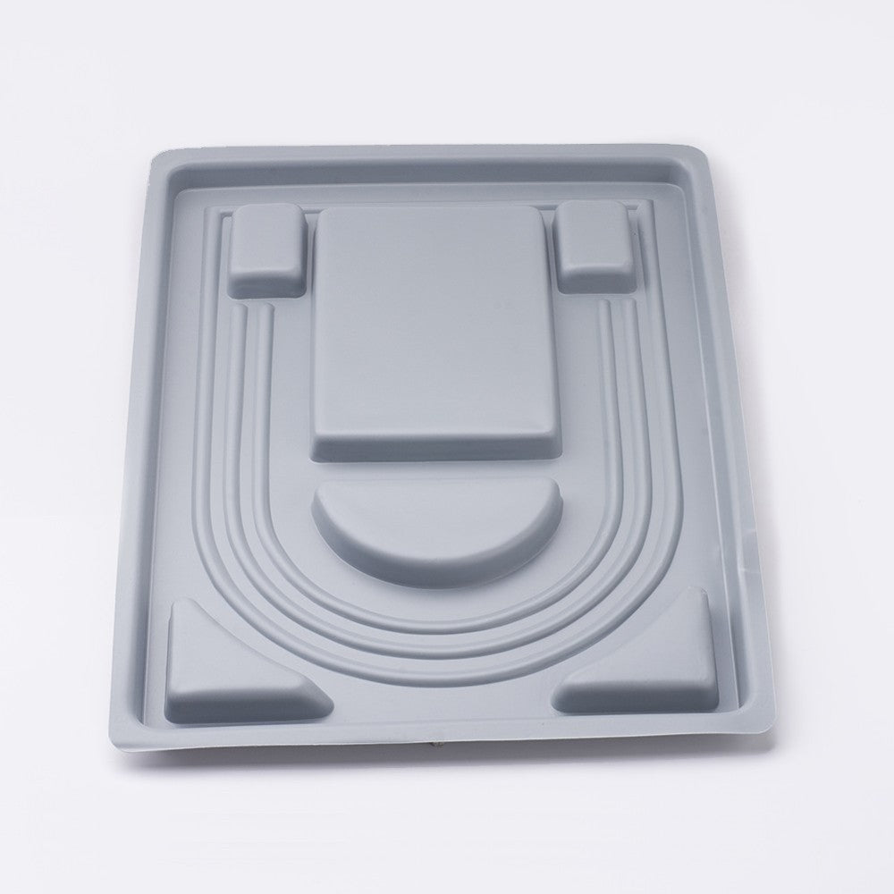 reverse side of a necklace design tool on a white background