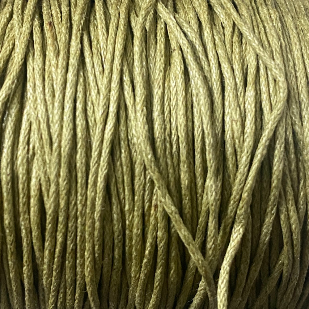 close up of pale olive khaki green coloured wax cotton cord for craft