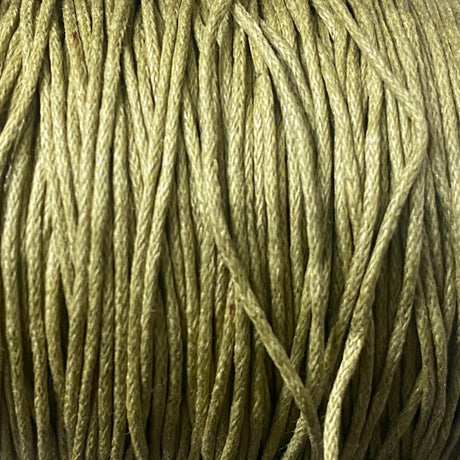close up of pale olive khaki green coloured wax cotton cord for craft