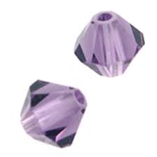 Two purple beads with a faceted design on a white background