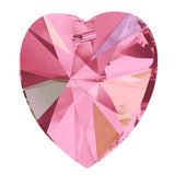 Pink heart-shaped crystal on a white background
