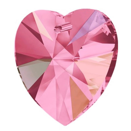 Pink heart-shaped crystal on a white background