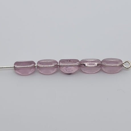 pinched rice light purple beads on a pin with a white background