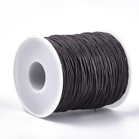 A spool of waxed cotton cord in brown color for crafting and jewelry making.