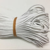 A bundle of thick white wax cotton cord used for crafting and jewelry making.